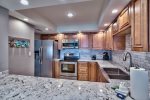Completely renovated kitchen with granite countertops and stainless steel appliances
